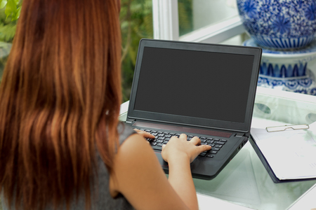 business women working on laptop in office in morningの写真素材