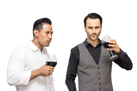 business man drink wine with isolated white bakc groundの写真素材