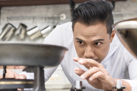 Chefs open the grill to cooking with  In the kitchenの写真素材