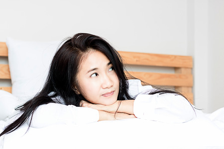 women sleep on bed and thinking in job with in bedroomの写真素材