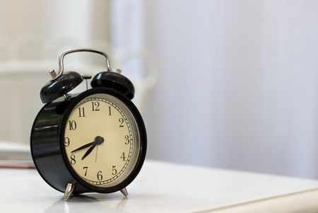 Old clock  on the table in living roomの写真素材