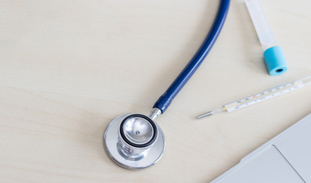 stethoscope and Fever instrument on wood table.Medical equipment for doctorの写真素材