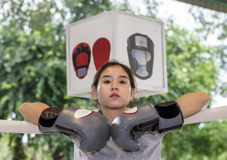Female boxer breaks practice after hard fightingの写真素材