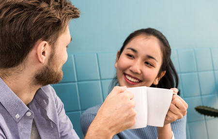 man and women drinking coffee in the morning in homeの写真素材