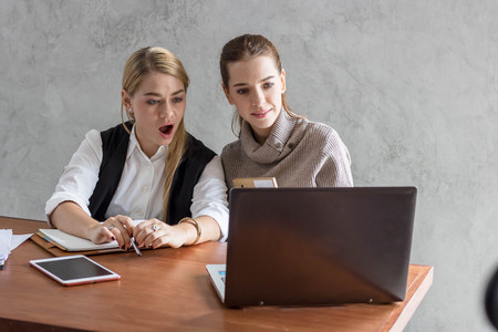 business women talking job in office in morningの写真素材