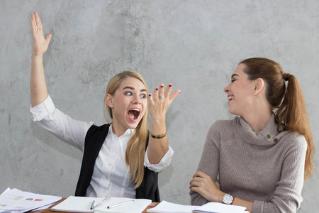 business women talking job in office in morningの写真素材