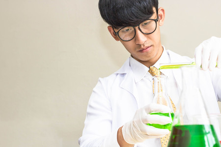 Scientists experiment with green compounds.の写真素材