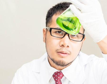 Scientists experiment with green compounds.の写真素材