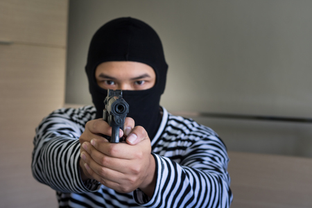 Bandit holding shot gunの写真素材