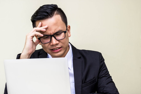 business man strain Because  job unsuccessful with hard job