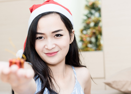 women holding red gift box for Christmas and happy new year dayの写真素材