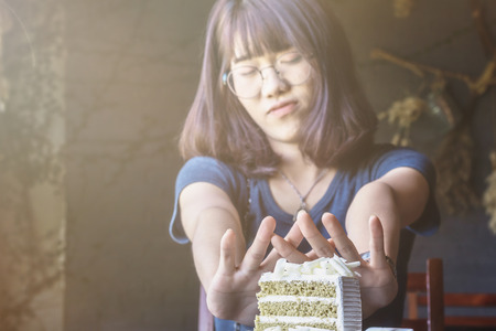 beautiful asian women stop eating in time weight control with diet food.color toneの写真素材