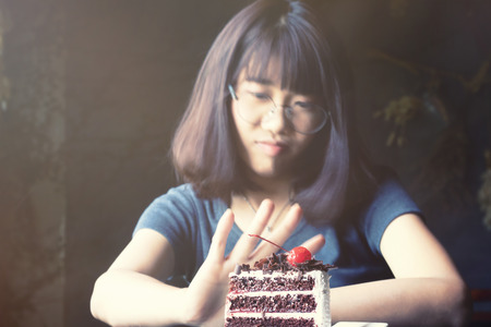 beautiful asian women stop eating in time weight control with diet food.の写真素材