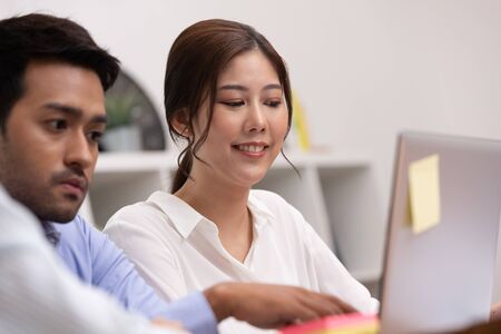 Asian business man and women meeting and talk about job in office.の写真素材