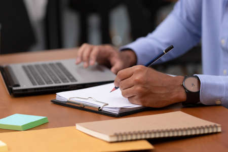 Close up hand man take note and talk job in business meeting.