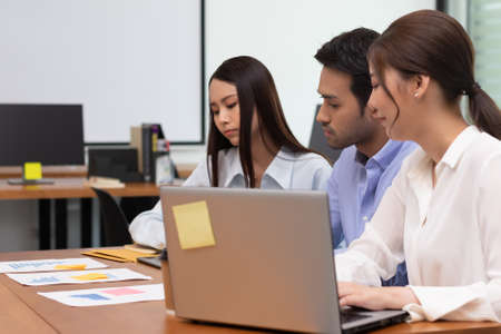Asian business man and women meeting and talk about job in office.