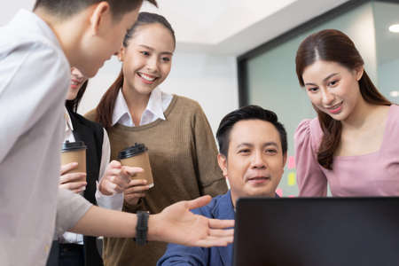 Asian business man and women meeting and talk about job in office.の写真素材