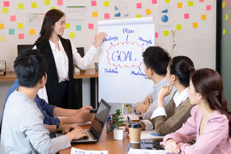Asian business man and women meeting and talk about job in office.の写真素材