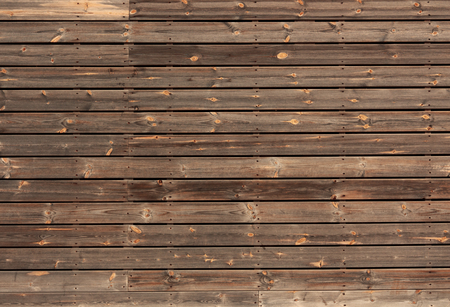 horizontal wooden boards tinted in brown colorの写真素材