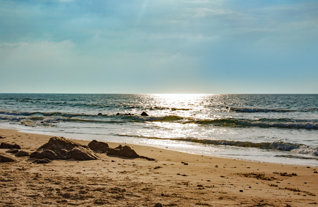 A few stones on the sandy shoreの写真素材