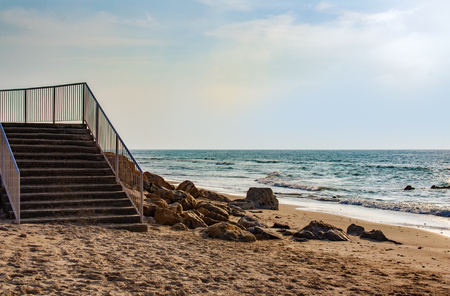 A stairs leading to the sea shoreの写真素材