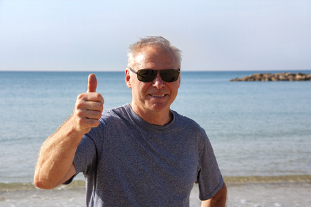 A man over 60 years shows a gesture all rightの写真素材
