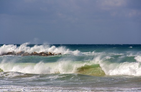 Foam waves in stormy weather on the Mediterranean seaの写真素材