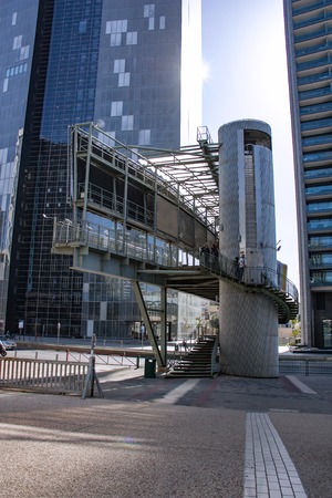 Pedestrian bridge across the road in the modern cityの写真素材