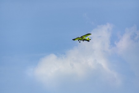 green airplane in the sky as a background