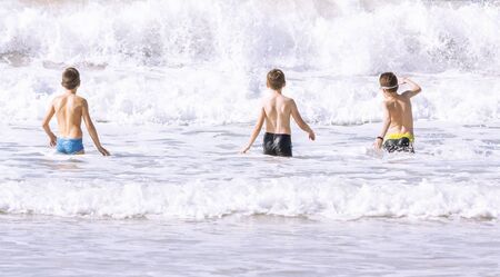 Children on the background of the seaの写真素材