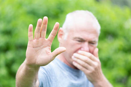 The sick person makes a gesture stop with his hand