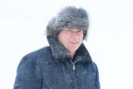 A man in a flight jacket in a snowfallの写真素材