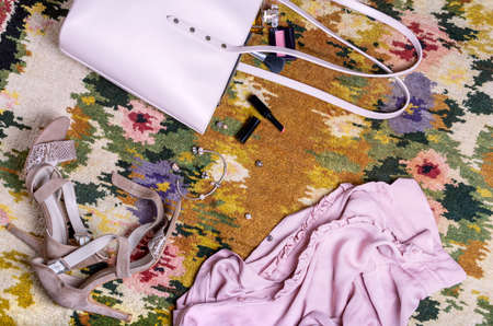 Womens clothes are beautifully scattered on the floor