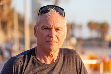 Portrait of a handsome elderly man in good shape at sunsetの写真素材