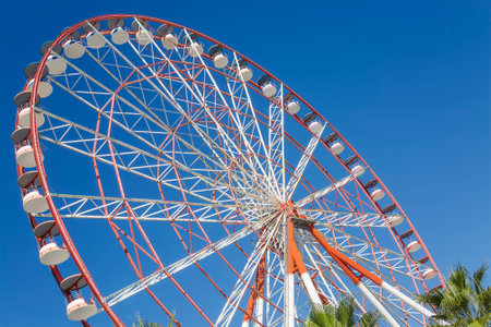 An empty big wheel on a blue sky backgroundの写真素材