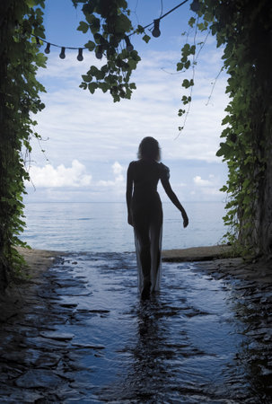 Silhouette of a girl coming out of the grottoの写真素材