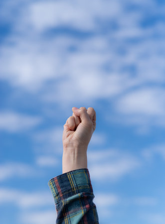 Raise your fist in the airの写真素材