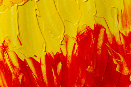 Background painted with red and yellow paintの写真素材