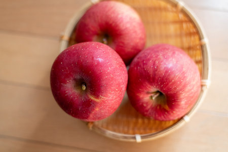 Delicious looking apples in a basketの写真素材