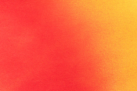 Red and yellow spray paint backgroundの写真素材
