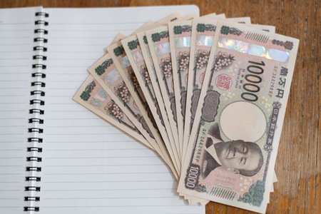 Paper money on blank noteの写真素材