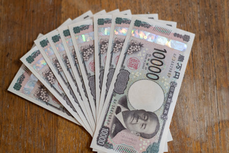 A pile of 10,000 yen billsの写真素材