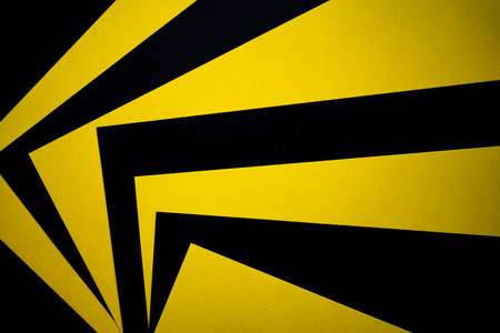 Overlapping yellow and black construction paperの写真素材