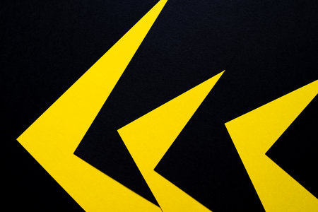 Overlapping yellow and black construction paper