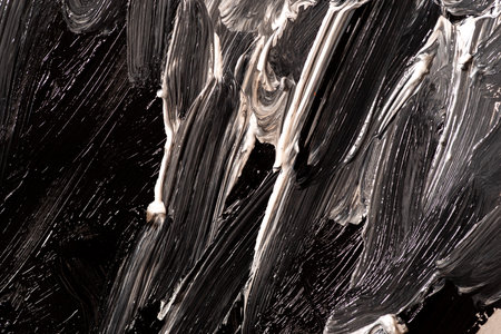 Black and white mixed paint backgroundの写真素材