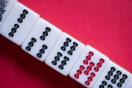 Mahjong tiles on a red background