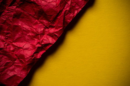 Crumpled red and yellow backgroundの写真素材