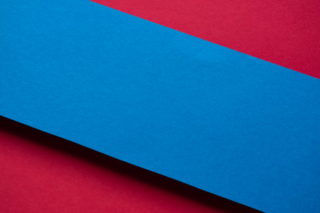 Overlapping red and blue construction paperの写真素材