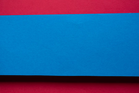 Overlapping red and blue construction paperの写真素材