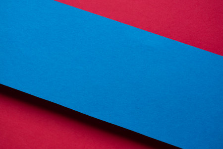 Overlapping red and blue construction paperの写真素材